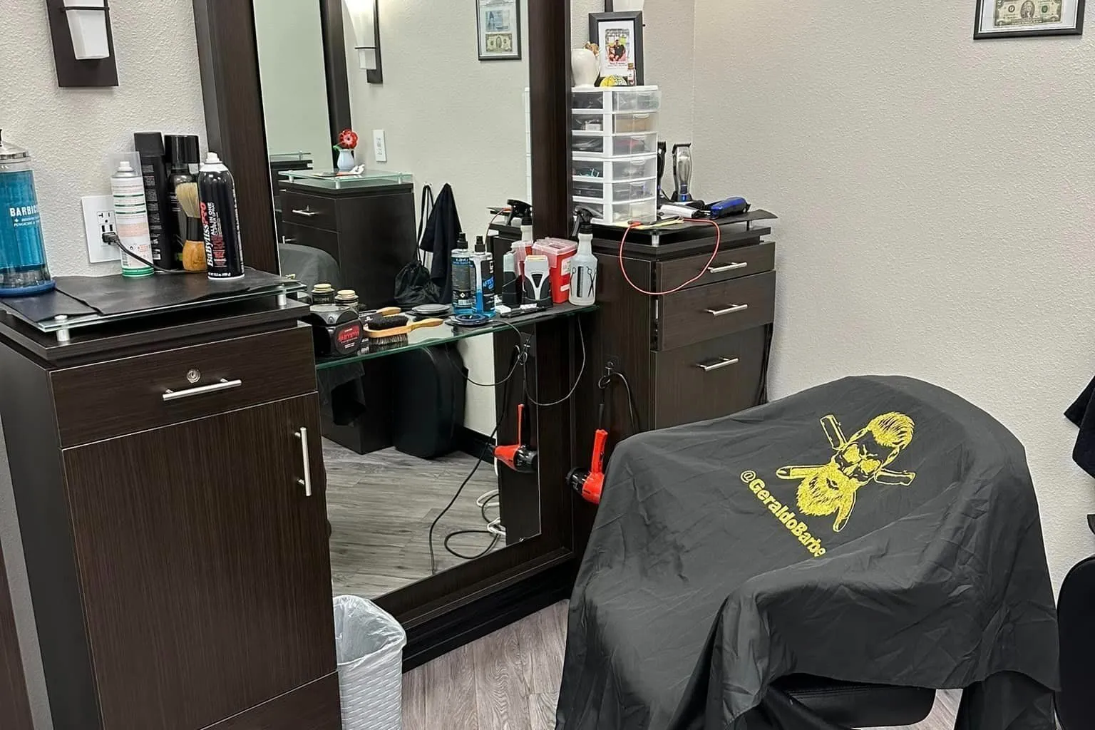Geraldo Barber styling chair with branded cape
