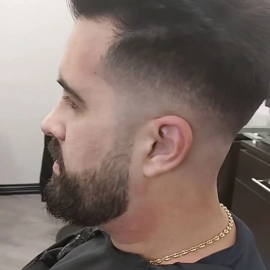 Skin fade blended into a sculpted beard
