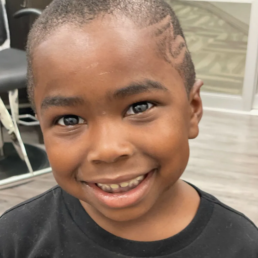 Young client smiling after a fresh haircut